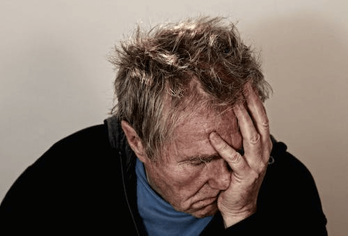 man-holding-his-face