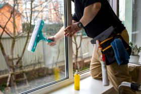man washing the window