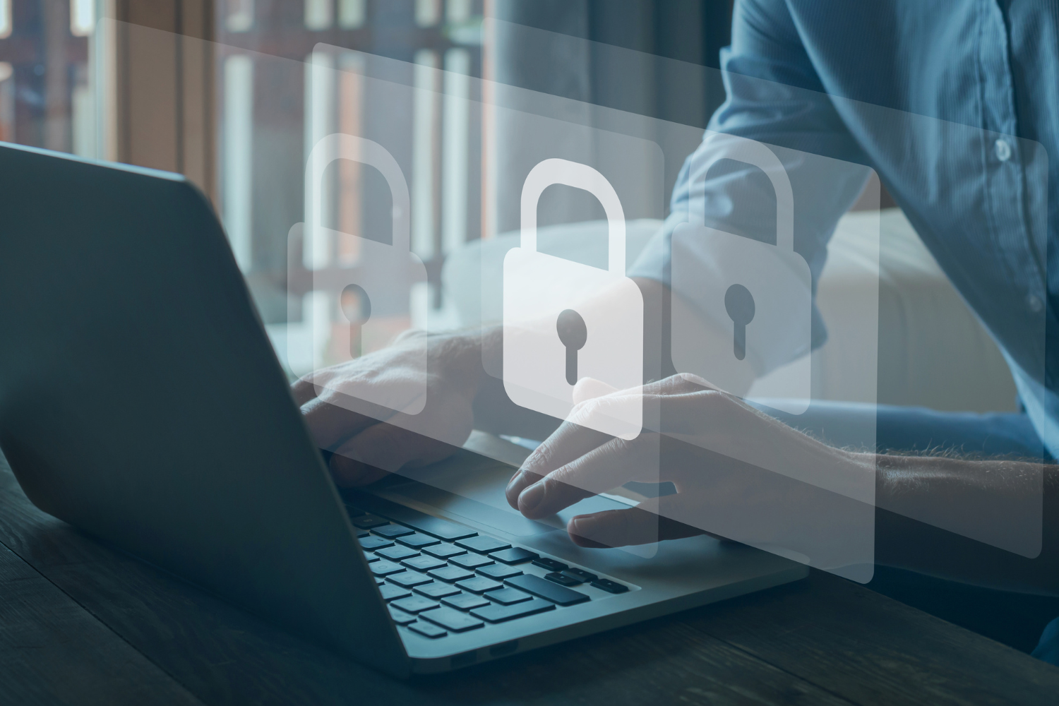 Person typing on a laptop with overlaid security lock icons, implying data protection.