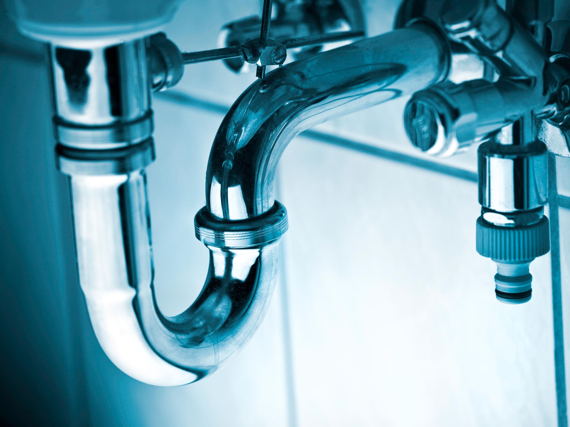 Plumber's Hand Using Plunger — Massillon, OH — Kamph’s Hardware and Plumbing Services