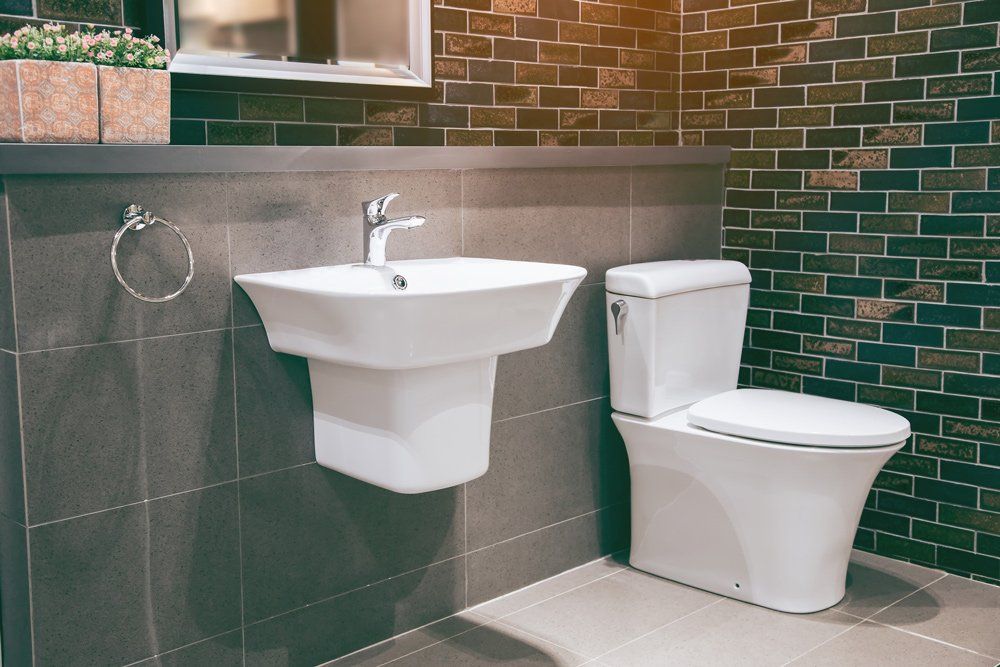 Bathroom with Toilet and Sink — Massillon, OH — Kamph’s Hardware and Plumbing Services