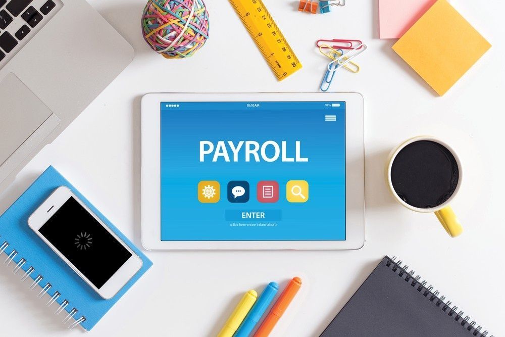 Tablet with payroll on Screen, Surrounded by Office Supplies — Books in a Mess Australia in Peats Ridge, NSW