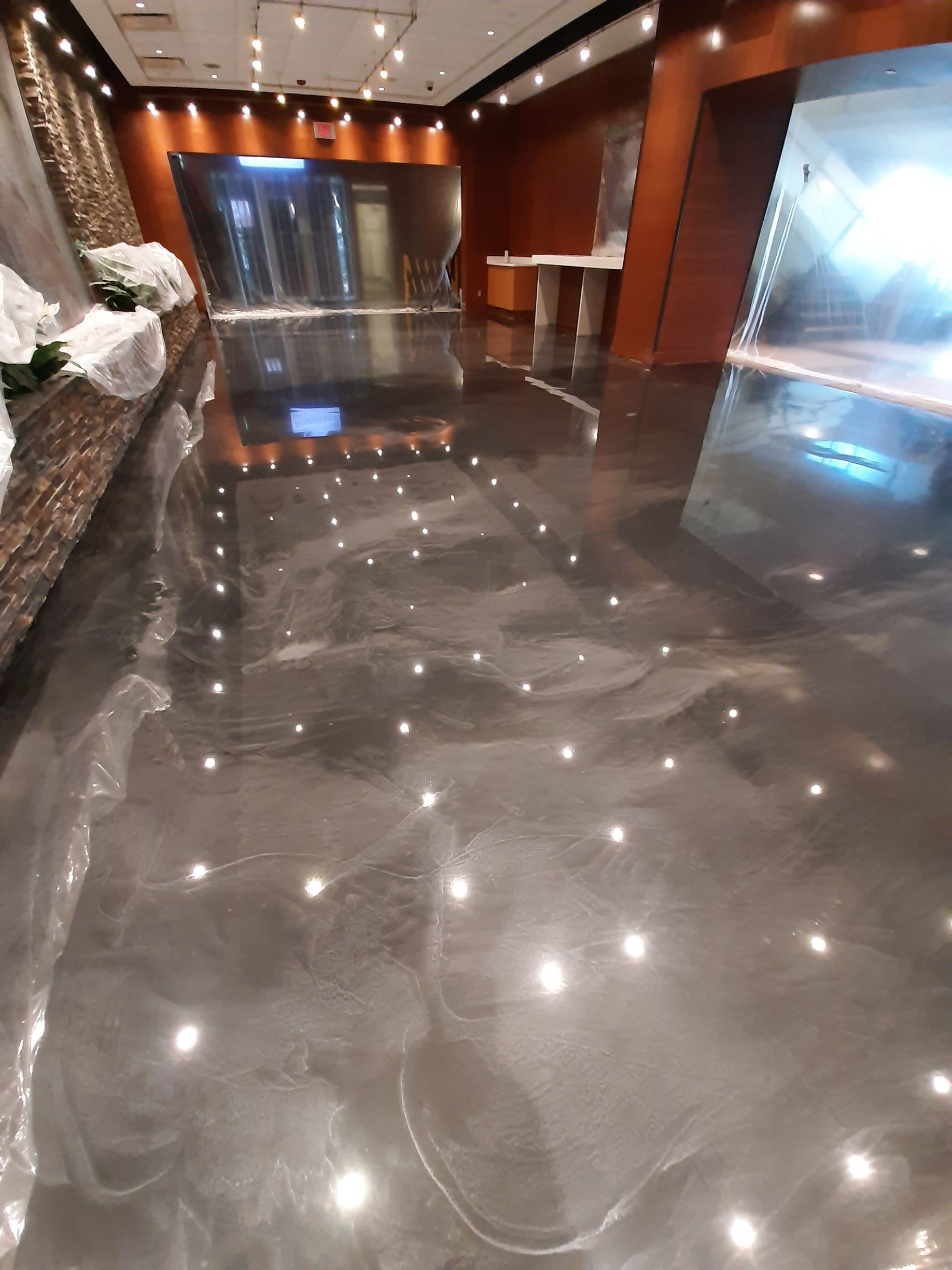A shiny floor with a lot of lights on it
