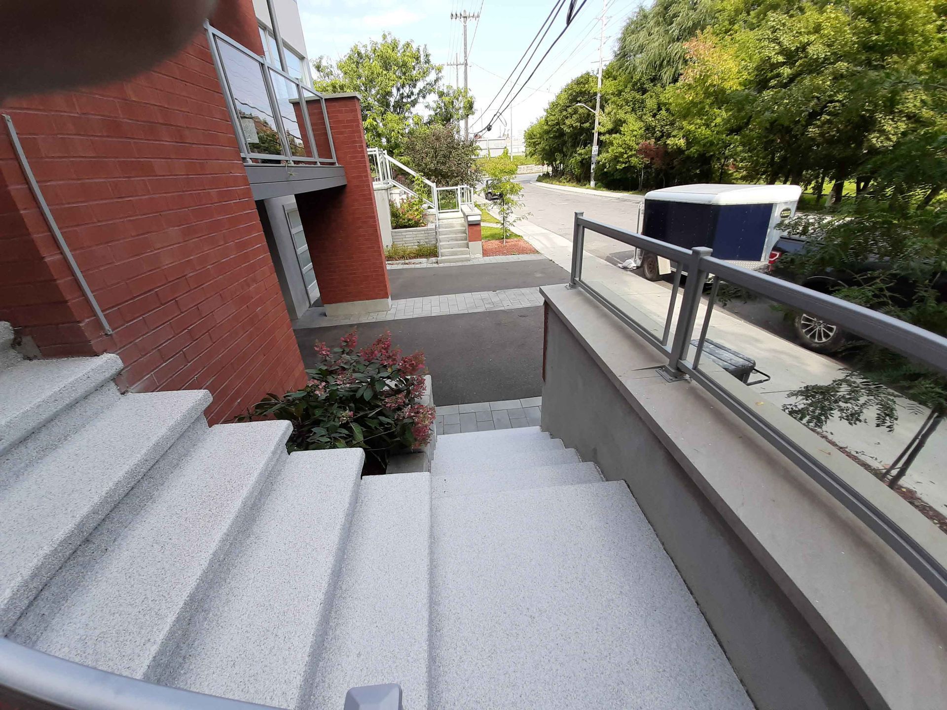 A set of stairs leading up to a brick building