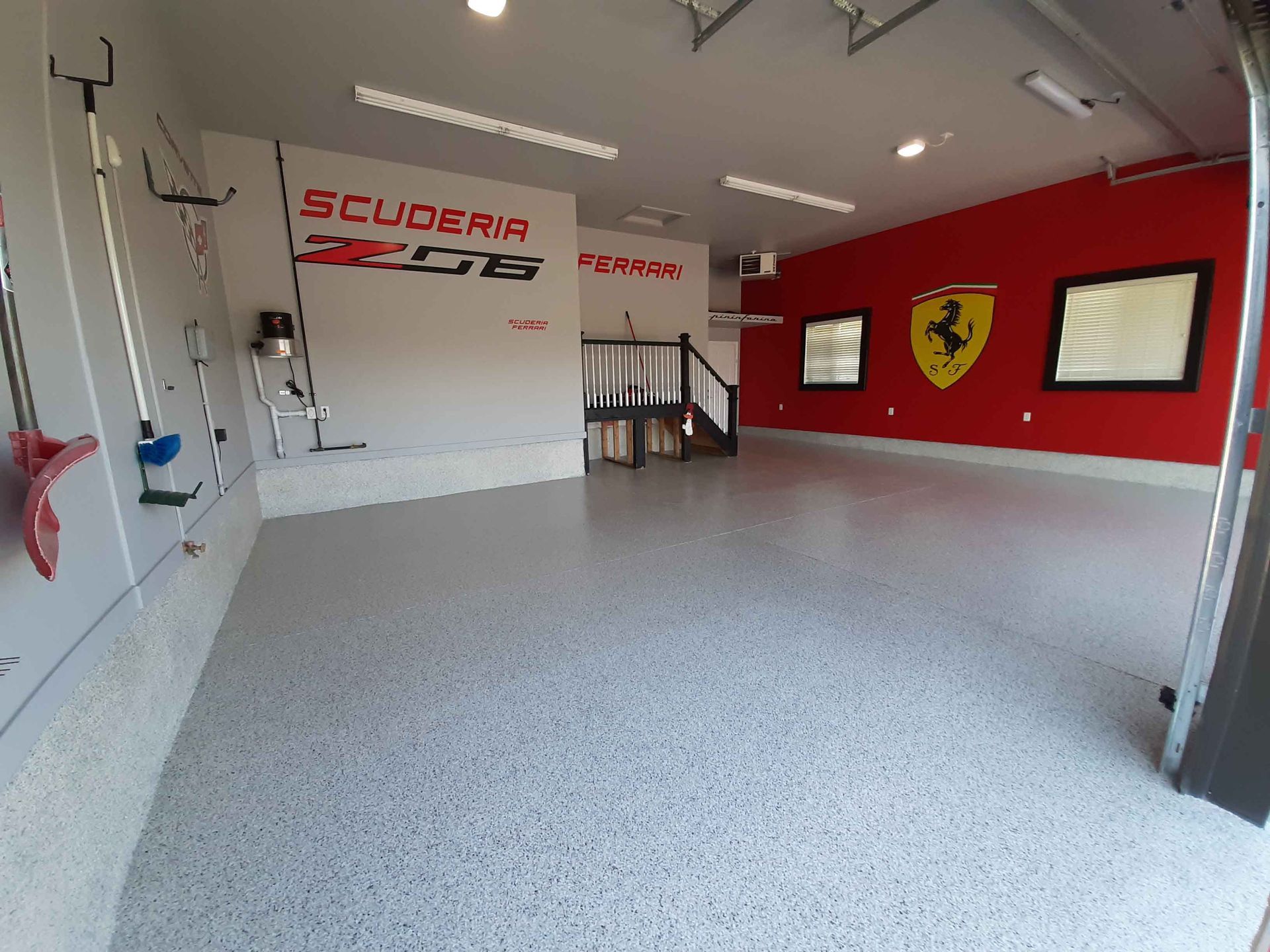 A garage with a ferrari logo on the wall