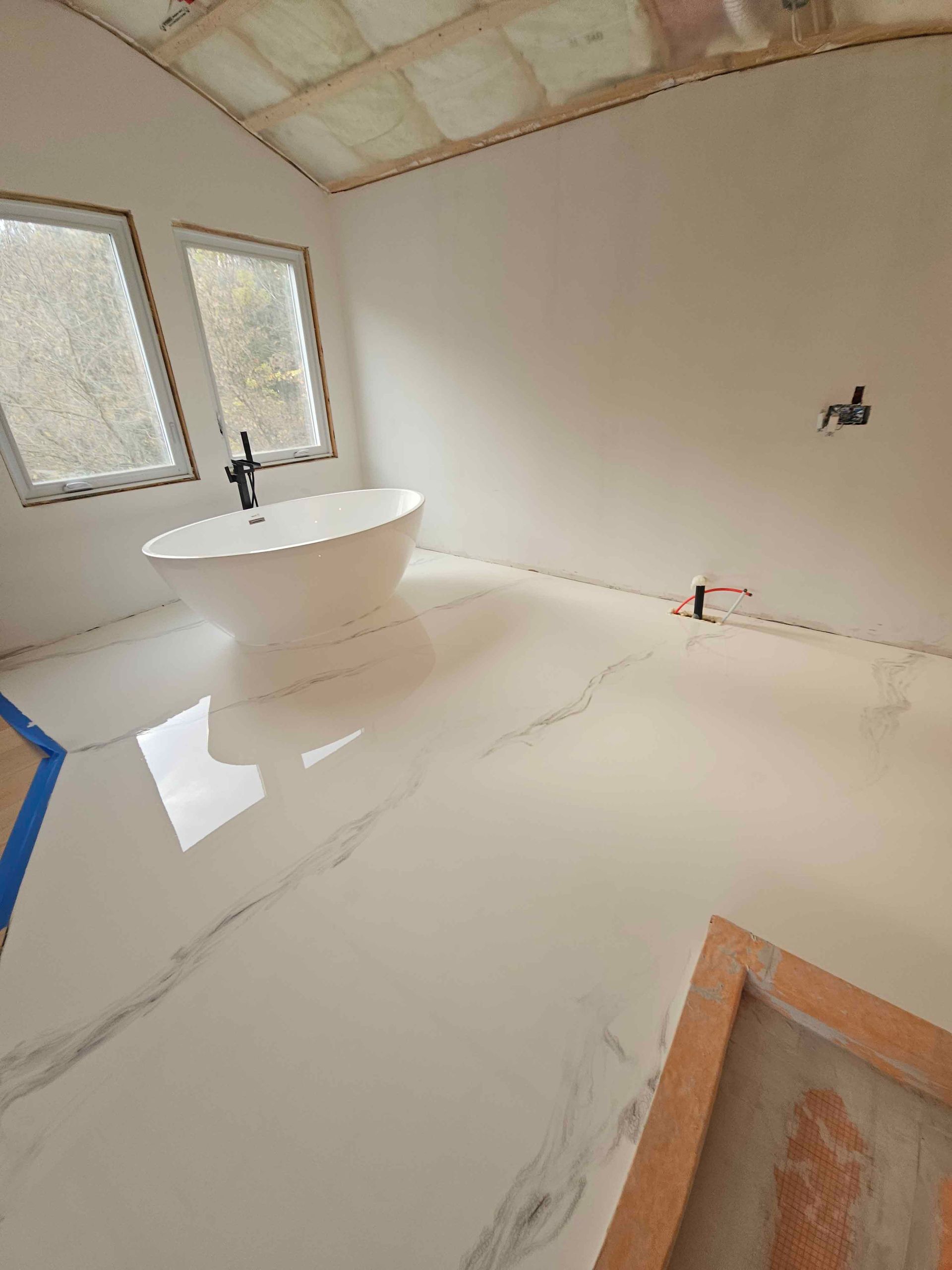There is a bathtub in the middle of the room.