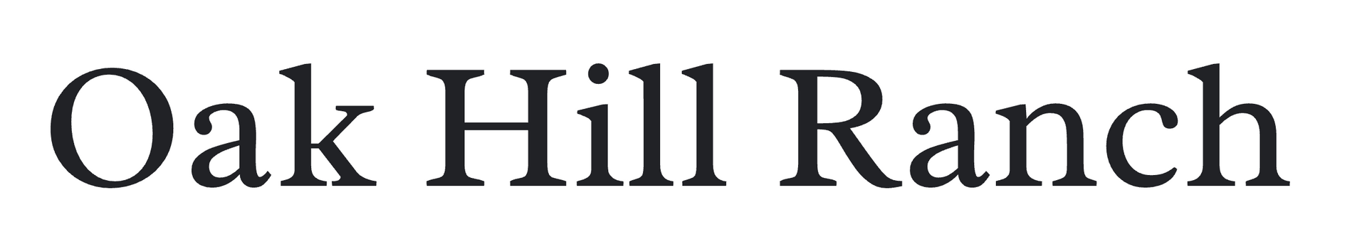 A black and white sign for oak hill farm