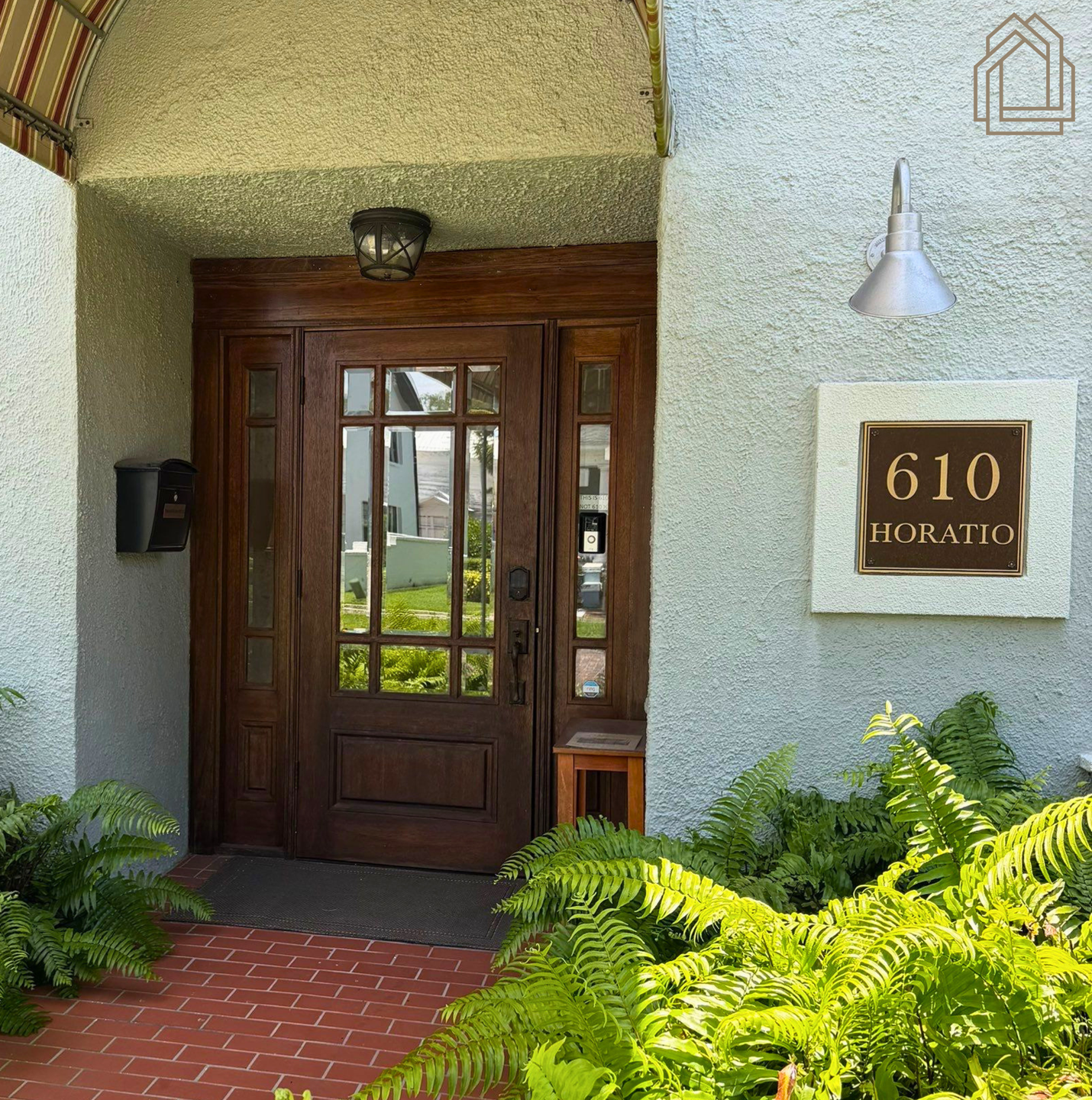Entrance to Pristine Remodeling's Tampa Bay office on Horatio Street, featuring a covered walkway and  entrance.