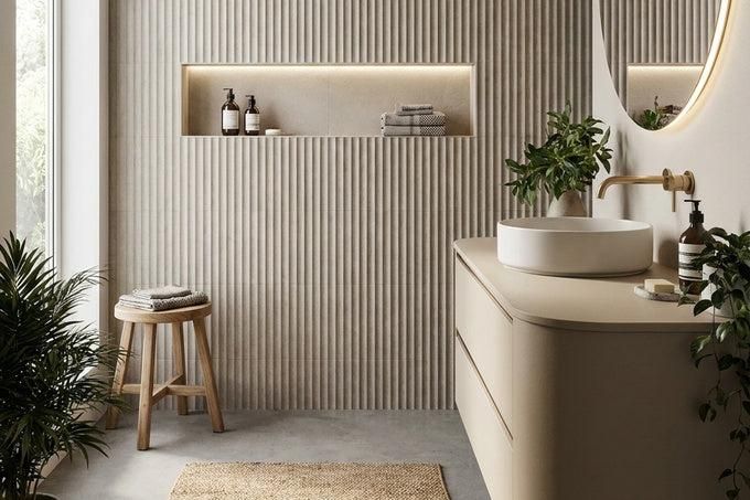 Contemporary powder room with textured, fluted wall tiles in warm taupe, adding architectural depth behind a modern vanity.