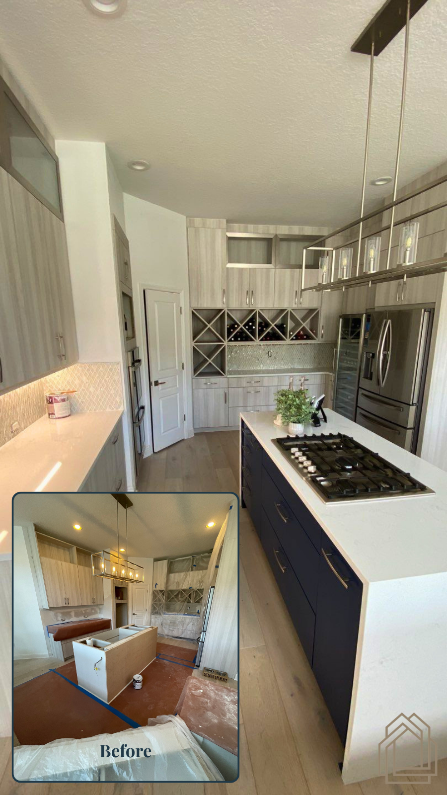 Bright narrow kitchen with white cabinets, dark island, and built-in wine rack; small living-room inset.