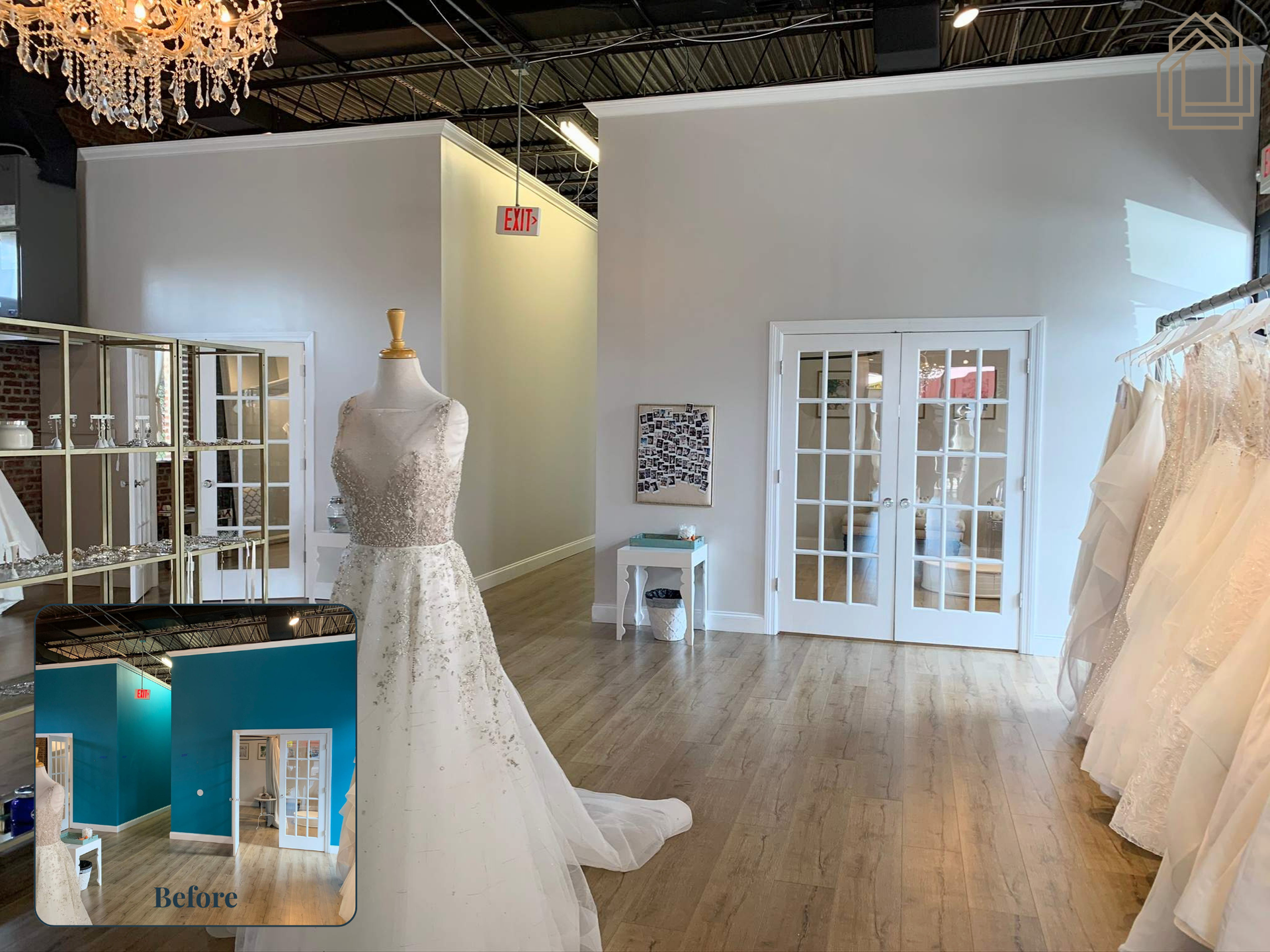 Bridal boutique interior with a white lace wedding dress on a mannequin and gowns hanging along the wall.