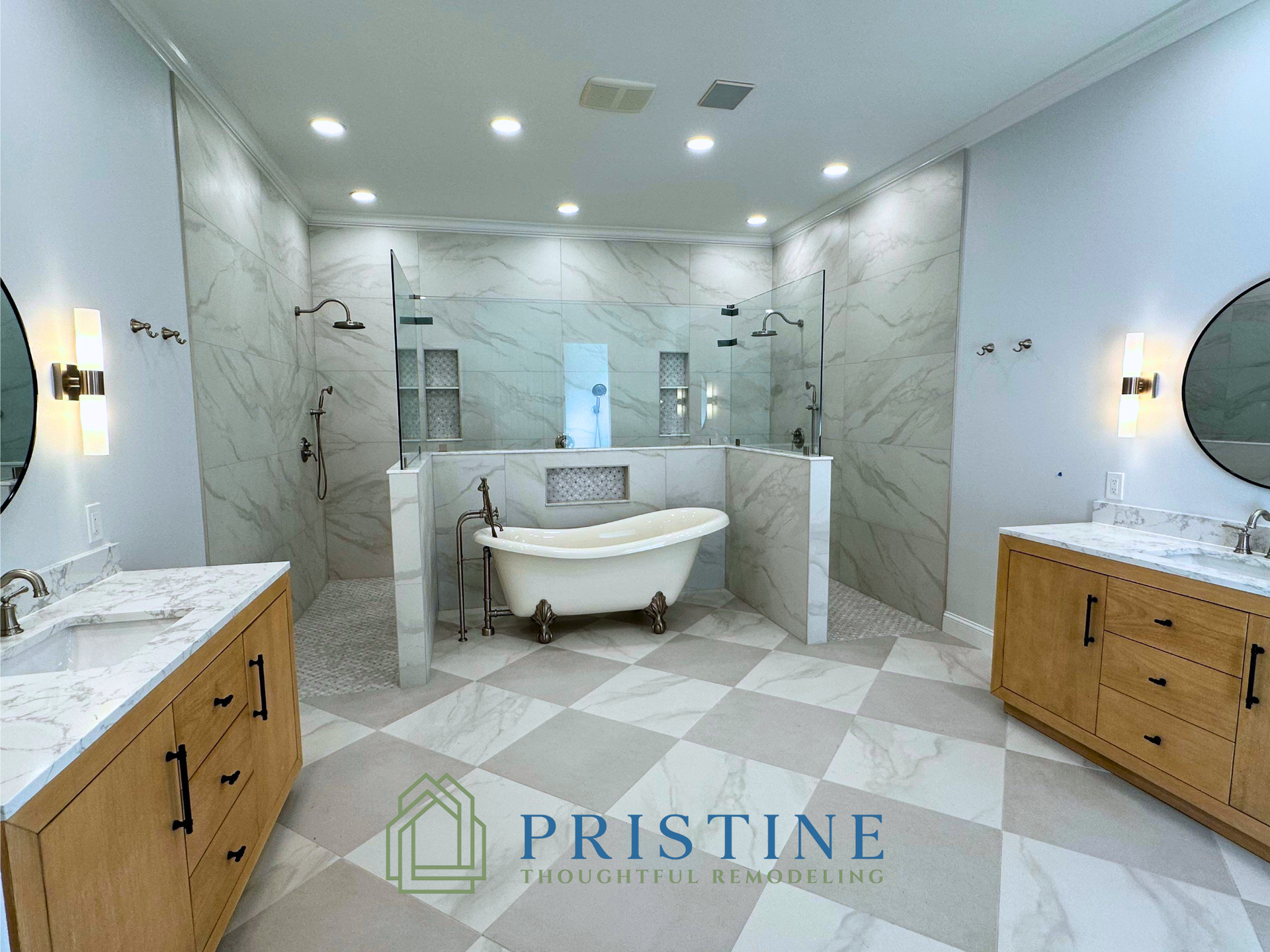 Elegant marble bathroom with freestanding tub, double vanity, and walk-in shower, in white and wood tones