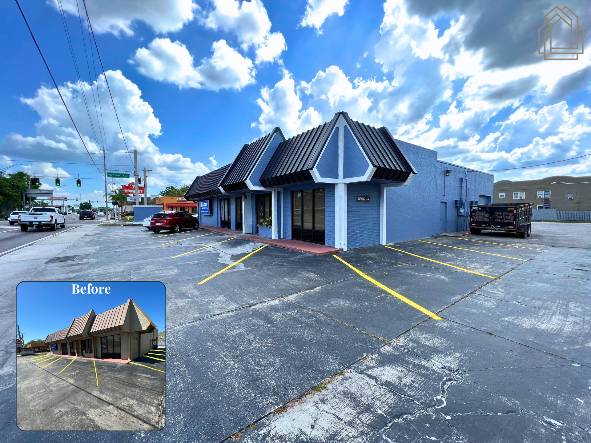 Street-side restaurant with a dark roof, blue building, parking lot, and a partly cloudy sky.