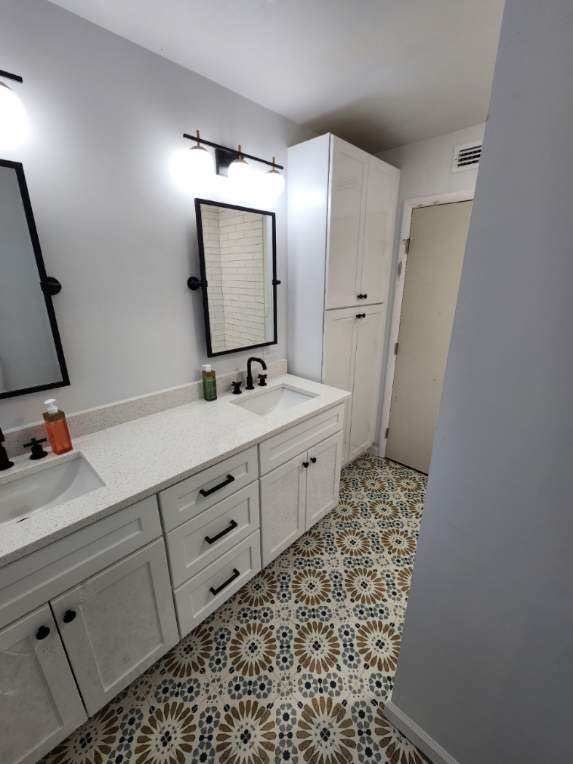 Bathroom lighting and vanity remodeling project in Lakeland FL with modern black fixtures