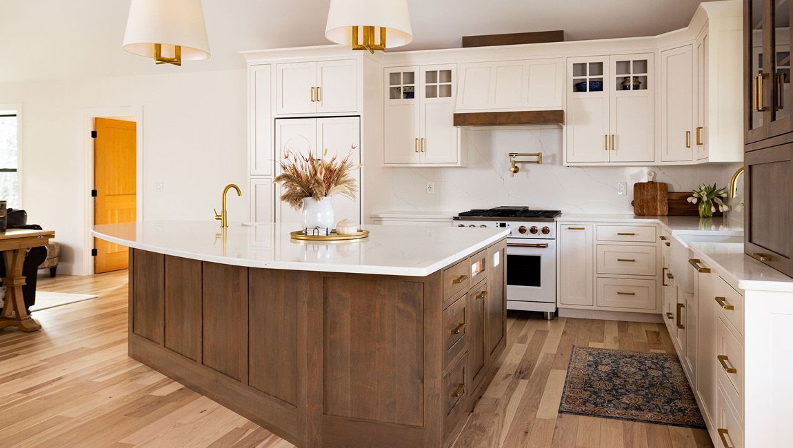 Custom kitchen cabinetry with oversized island, decorative details, and personalized storage solutions.
