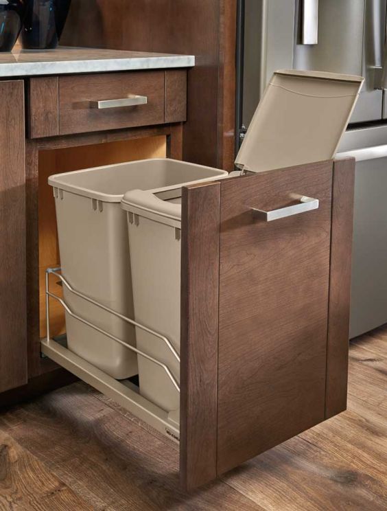 pull out trash cabinet
kitchen trash pull out
custom kitchen storage
hidden trash cabinet
cabinet organization ideas