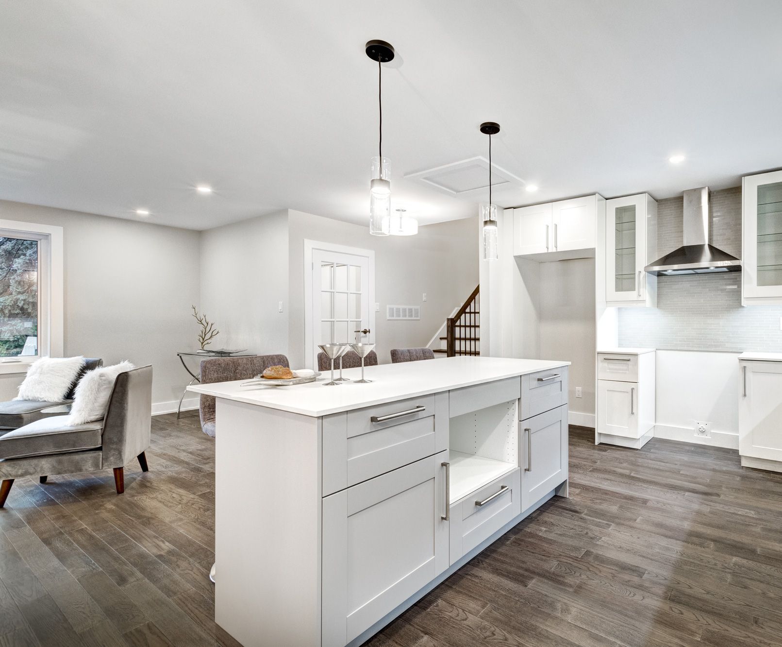 Renovated luxury house with white-themed interior and furniture, wooden flooring