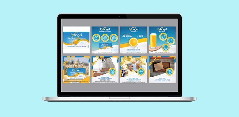 Laptop screen showing a grid of colorful product tiles or app cards on a blue interface