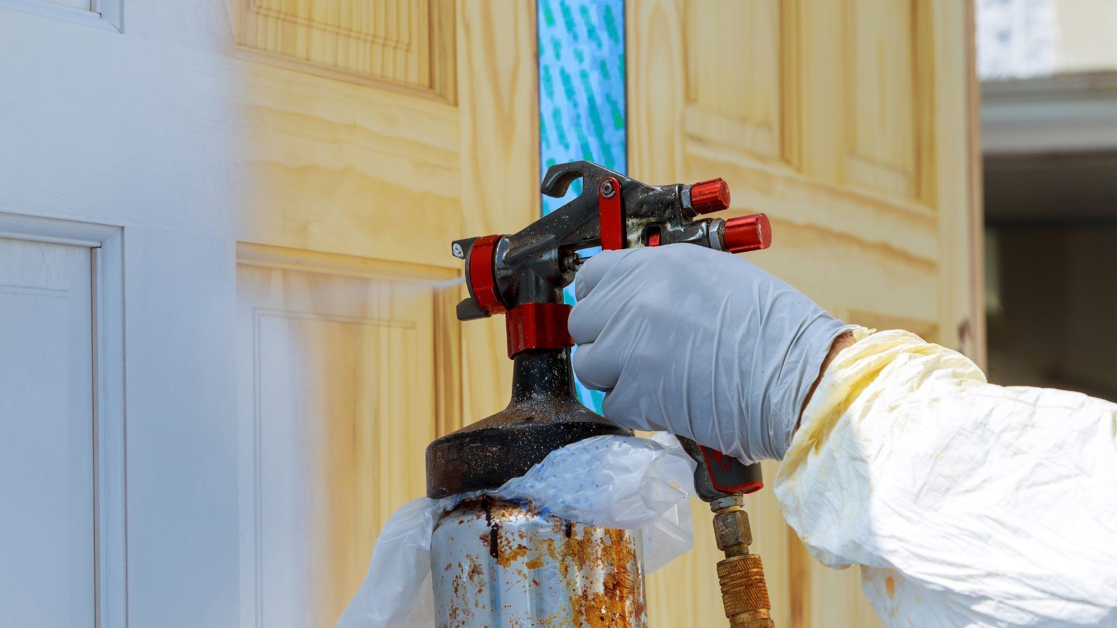 Professional painting door with spray gun
