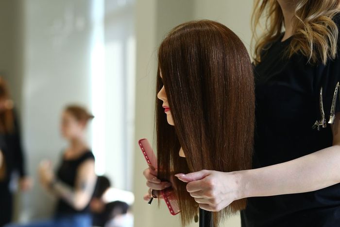 A woman wearing a long wig