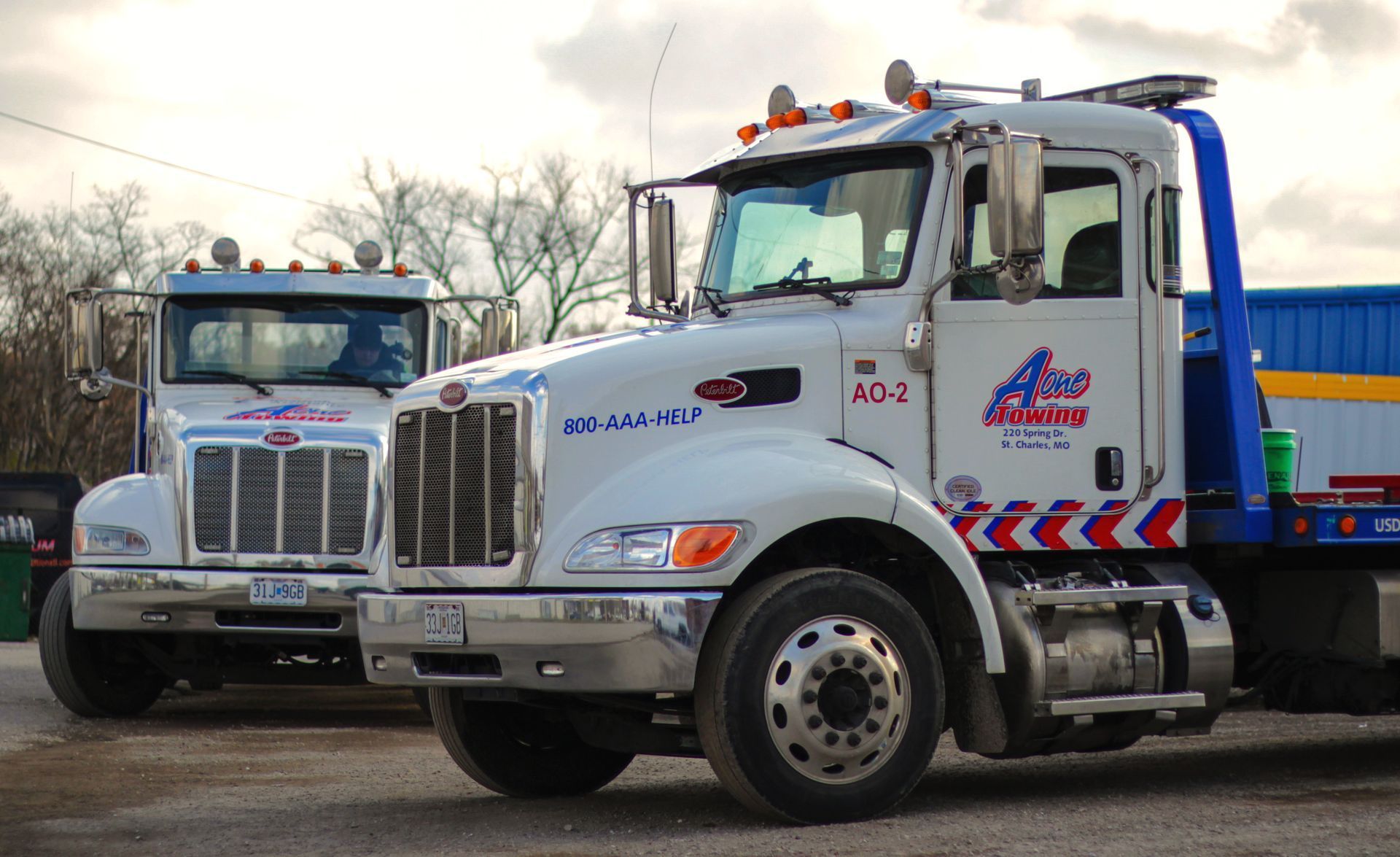 Two white tow trucks.