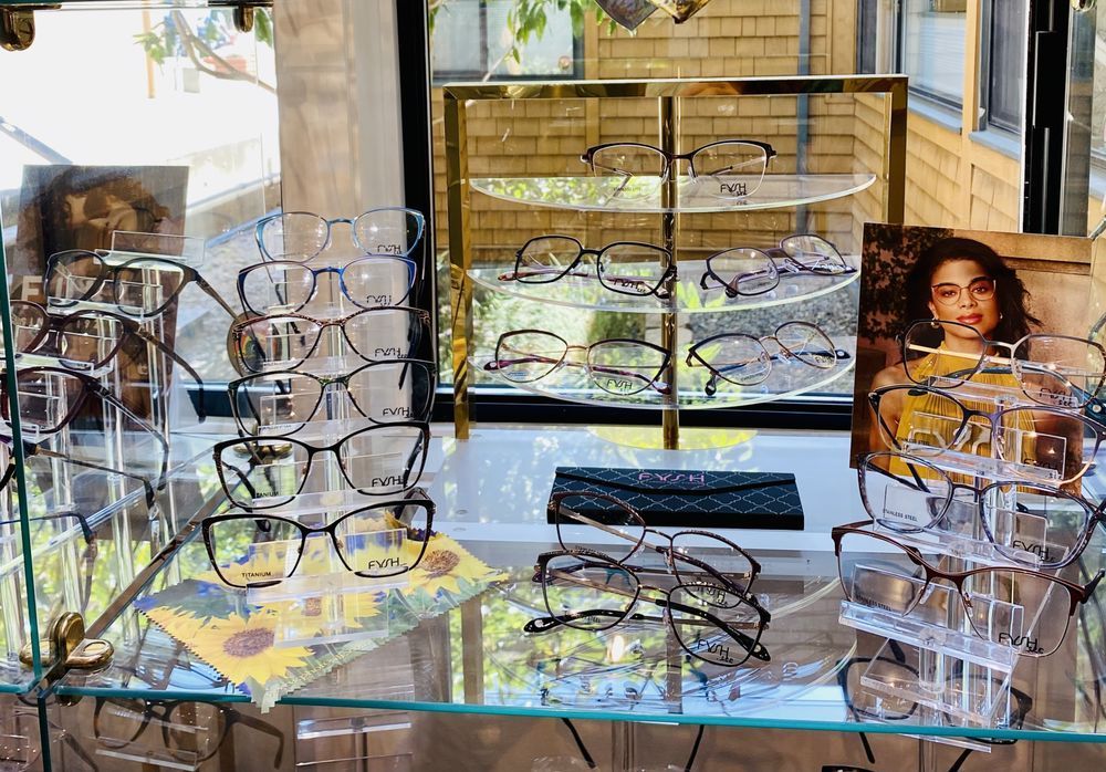 A display case filled with glasses and a picture of a woman — Eye Care in San Rafael, CA A display case filled with glasses and a picture of a woman — Eye Care in San Rafael, CA