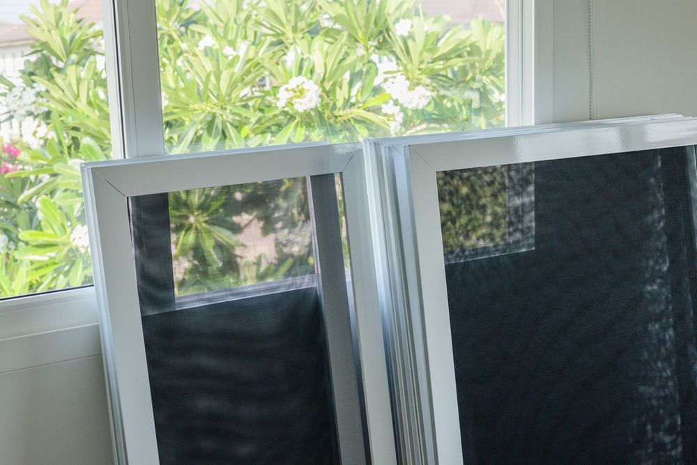 Two White Frames Window — Ezi Slide - Glass, Sliding, Track & Security Doors Repair in Gold Coast, QLD
