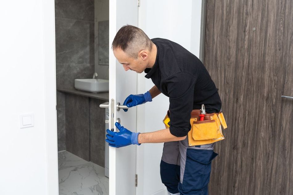 Fixing A Door Handle In A Bathroom — Ezi Slide - Glass, Sliding, Track & Security Doors Repair in Ashmore, QLD