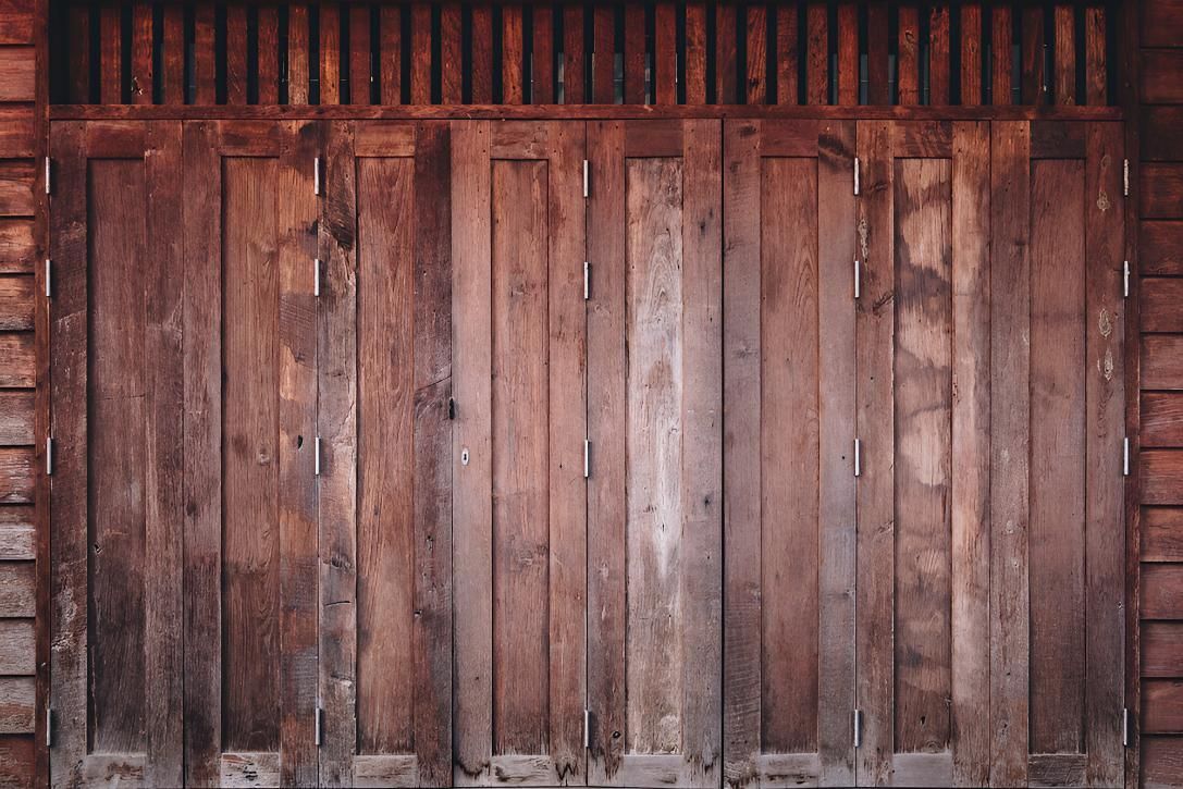 Close Up of a Wooden Door on a Wooden Wall — Ezi Slide - Glass, Sliding, Track & Security Doors Repair in Ashmore, QLD