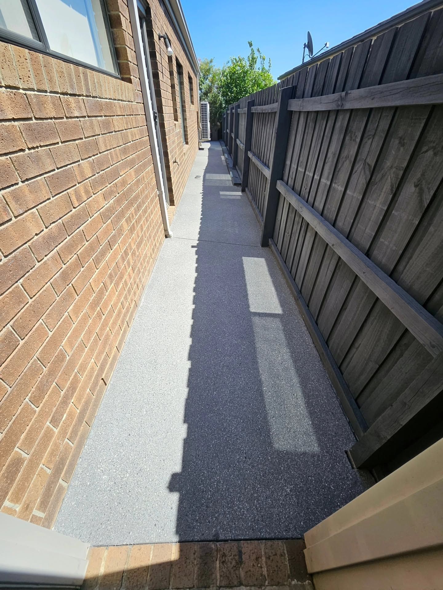 Side of house concrete restoration after photo in Berwick