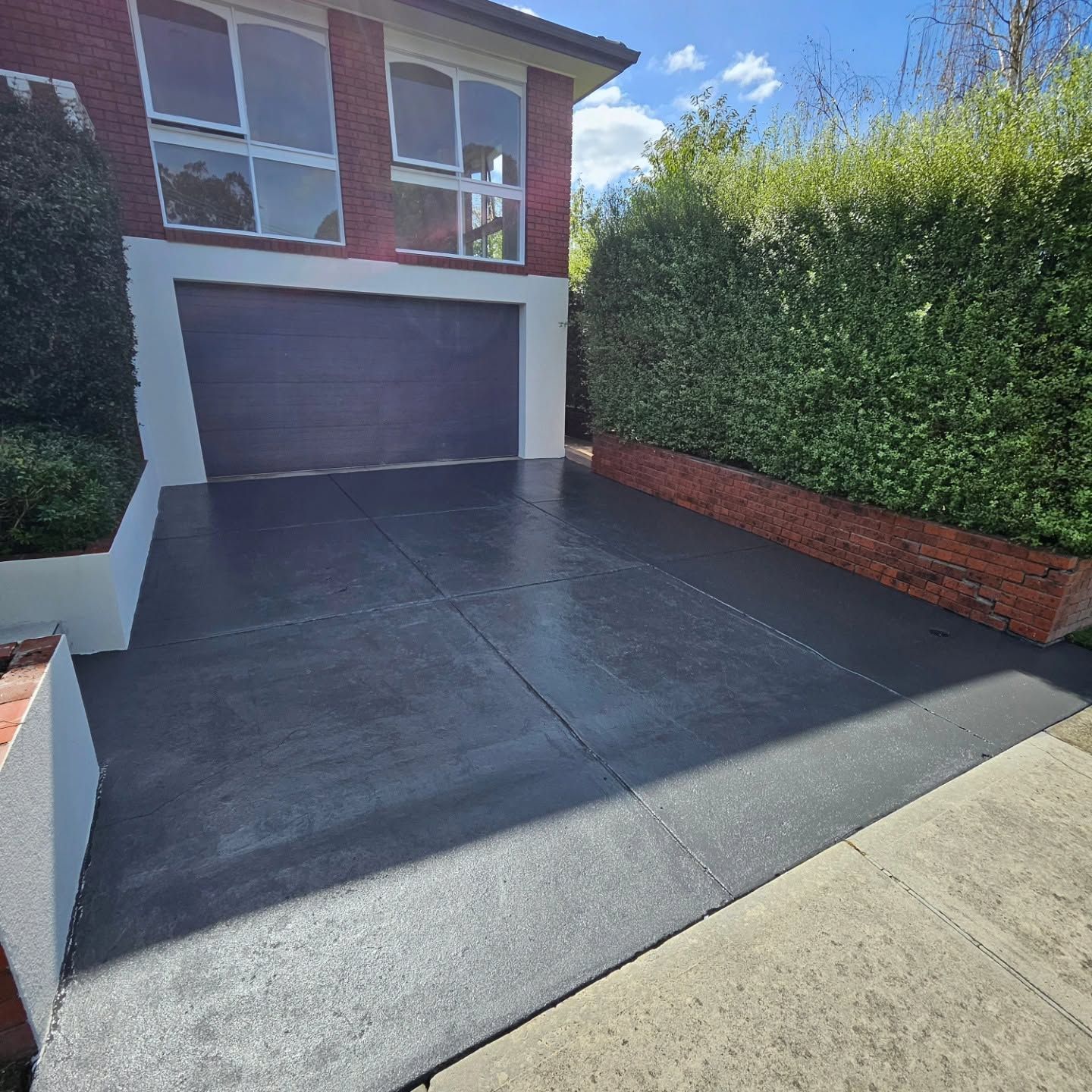After concrete driveway restoration and resurfacing in