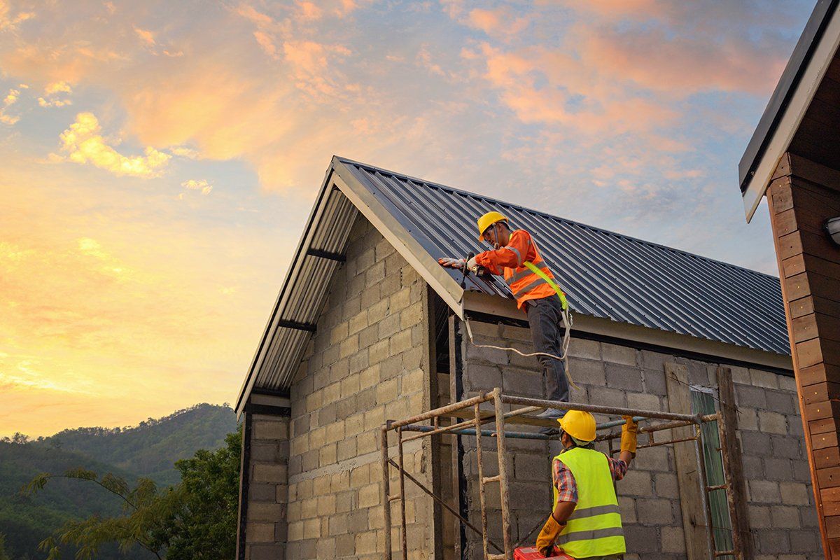 Two Workers Fixing Roof — Houston, TX — Sandtech – S. T. Construction Corp.