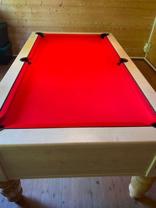 red cloth snooker table