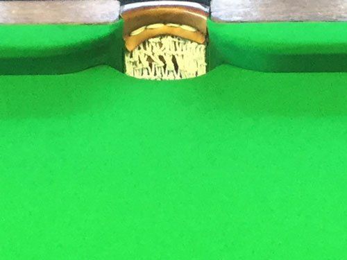 close up of pool table pocket
