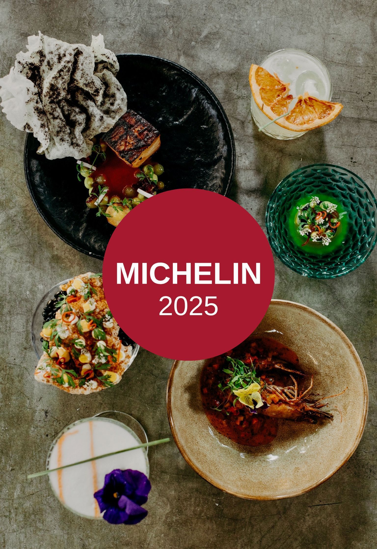 A table topped with plates of food and a red circle that says michelin 2025.