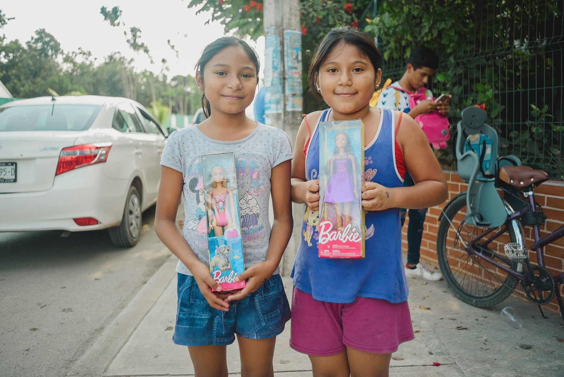 Kids receiving toys from WILD Tulum during Chrsitmas