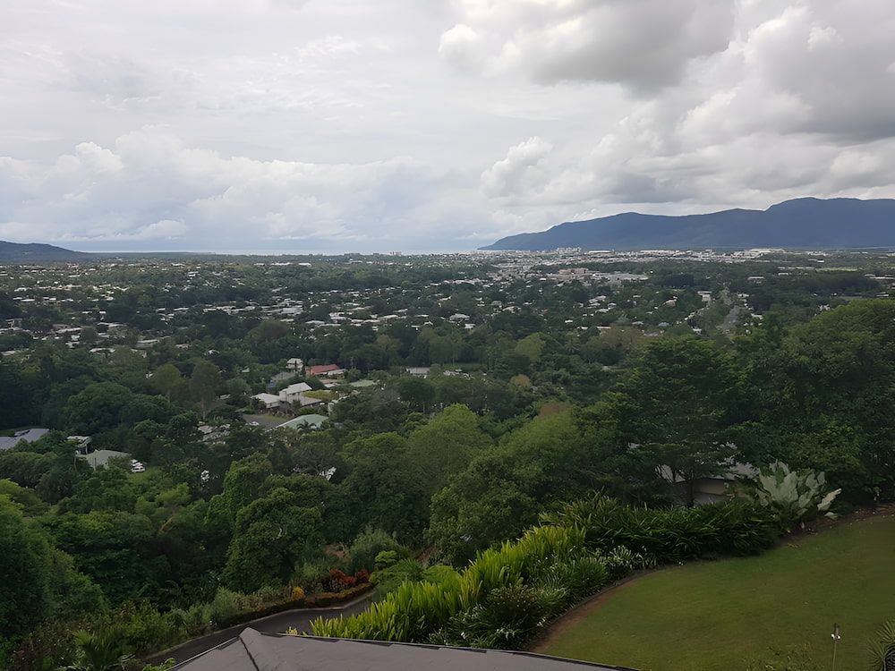 A  View of a City With Mountains in the Background — High Performance Roof Tiling P/L in Kewarra Beach, QLD