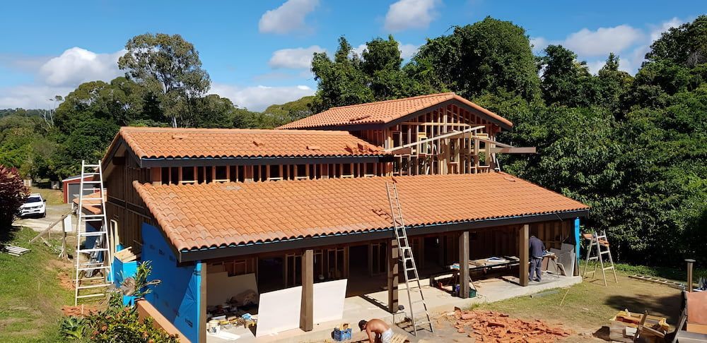 An Aerial View of a House Under Construction With a Tiled Roof — High Performance Roof Tiling P/L in Atherton Tablelands, QLD