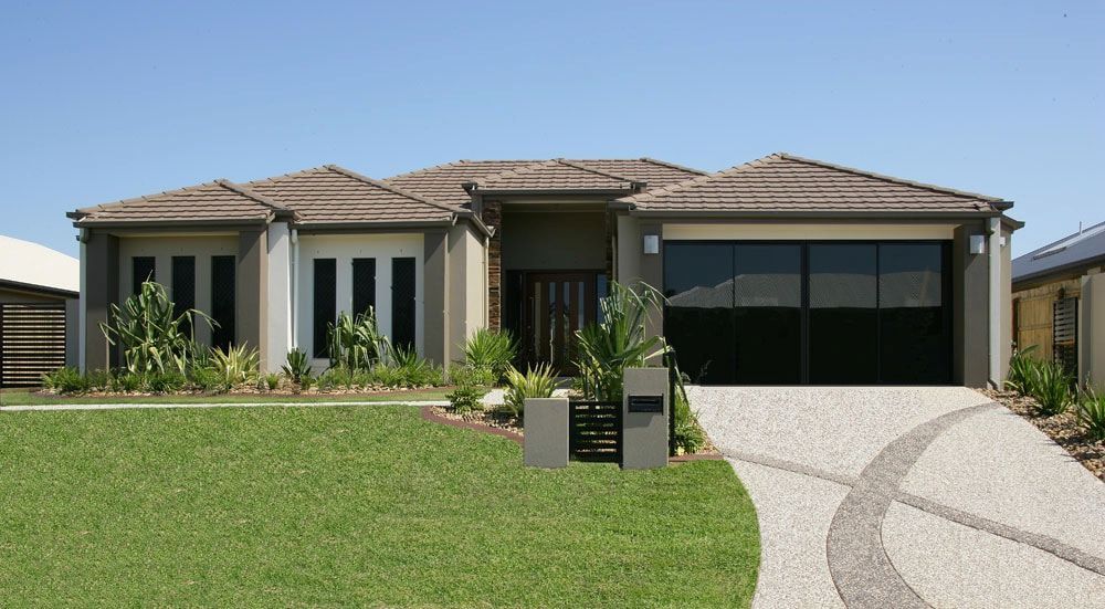 A Large House With a Driveway Leading to It — High Performance Roof Tiling P/L in Mossman, QLD
