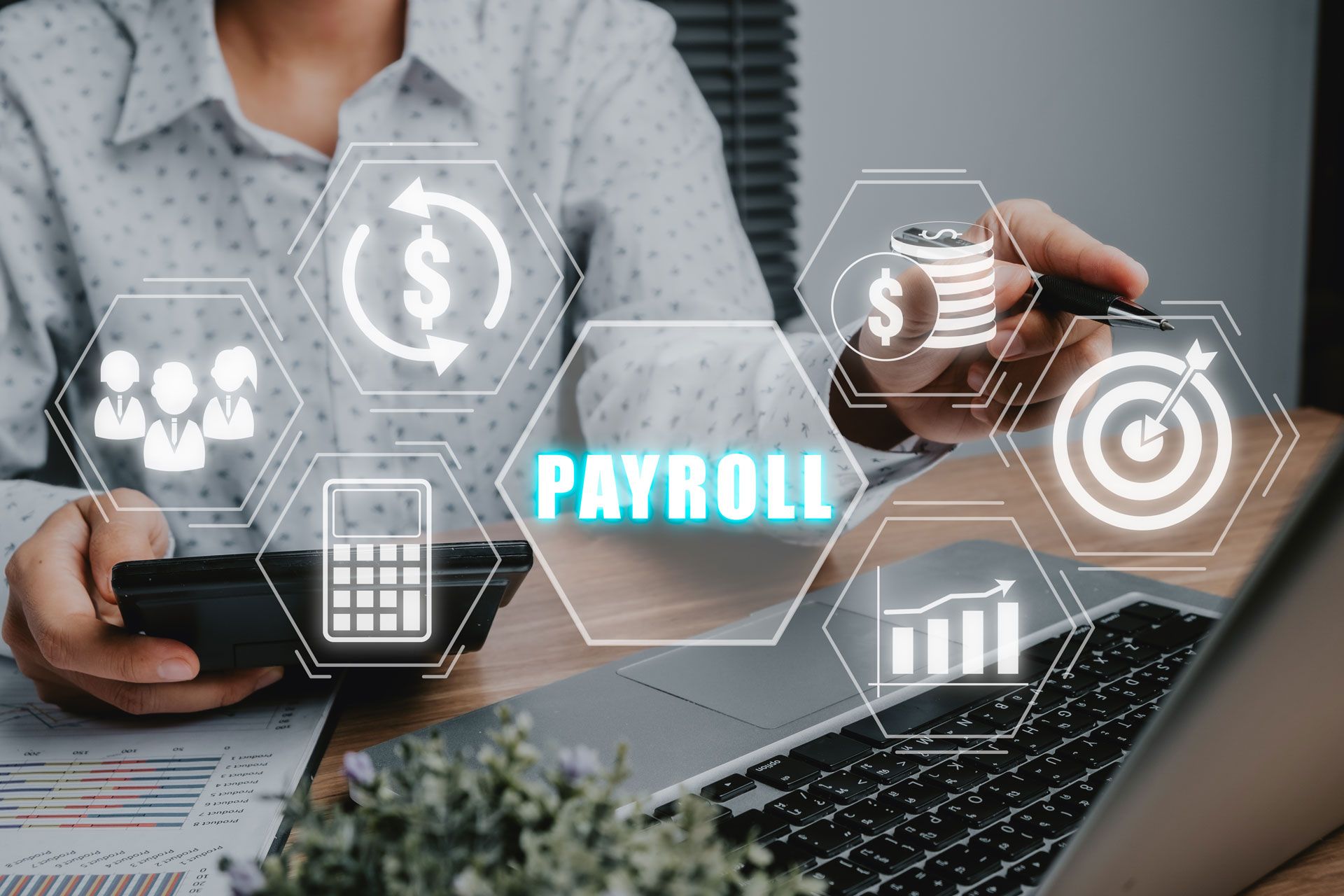 Person working on payroll with a laptop, calculator, and graphic icons.