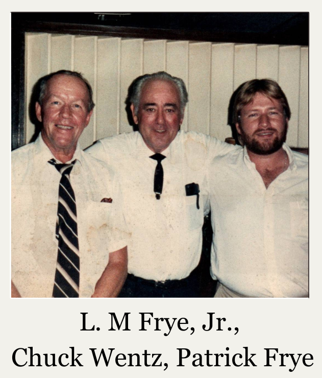 Three men standing together in white shirts and ties, labeled L. M. Frye, Jr., Chuck Wentz, and Patrick Frye.
