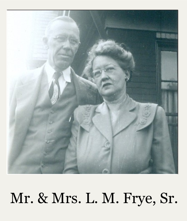 Portrait of Mr. and Mrs. L. M. Frye, Sr., standing together outdoors