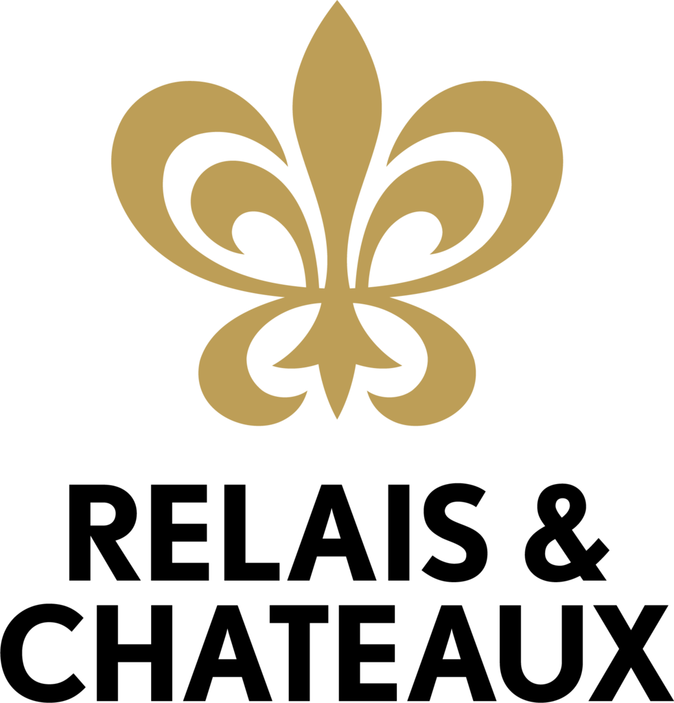 Gold fleur-de-lis logo above the black text “RELAIS & CHATEAUX”