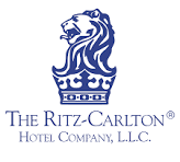 The Ritz-Carlton Hotel Company logo in blue with a lion crest and serif text