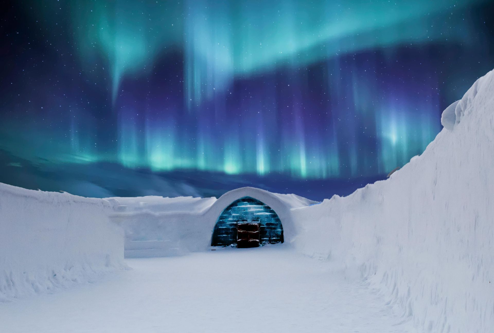 Snow tunnel under a glowing blue-green aurora in a wintry landscape