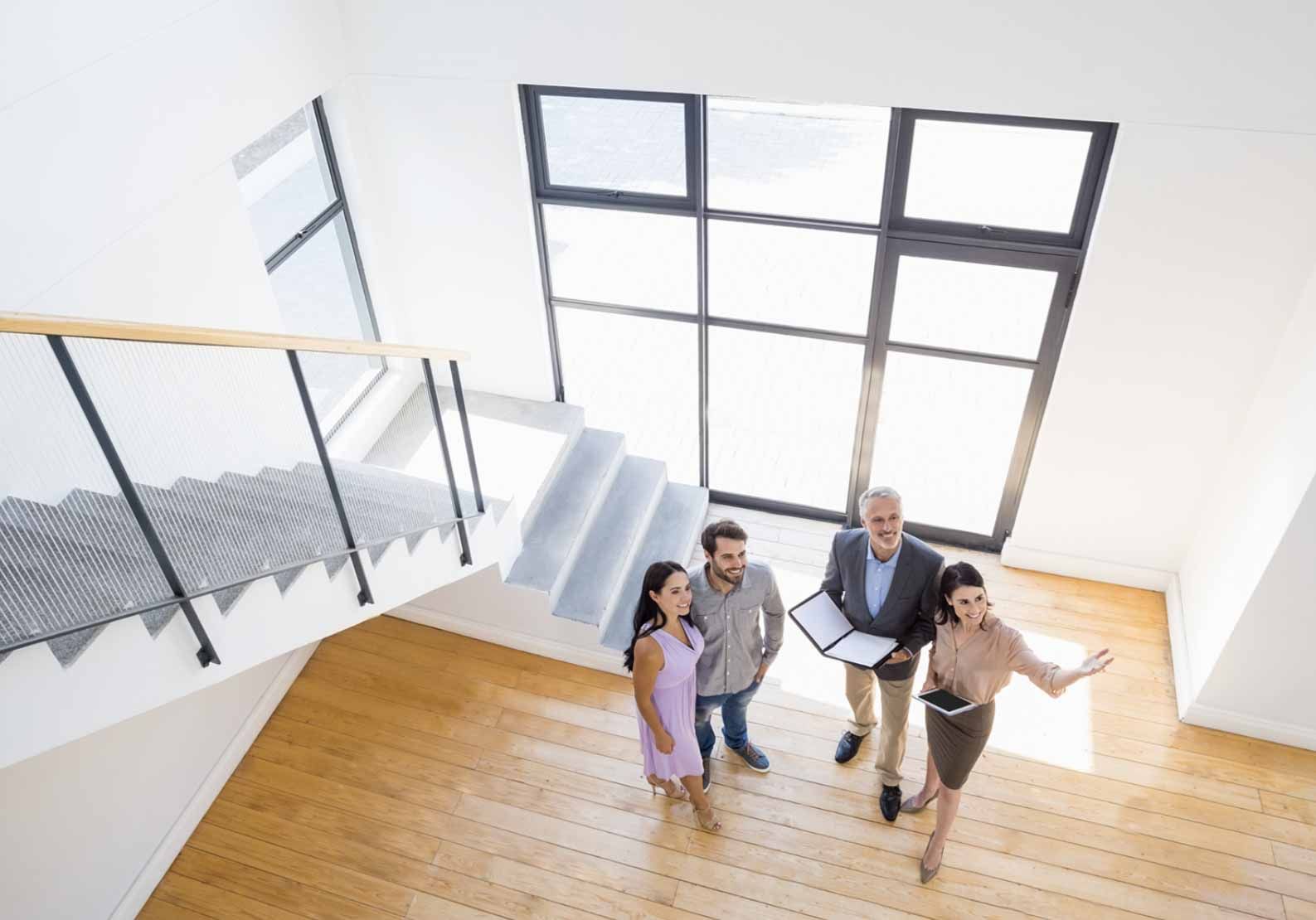 A group of people are standing around a table looking at a piece of paper.