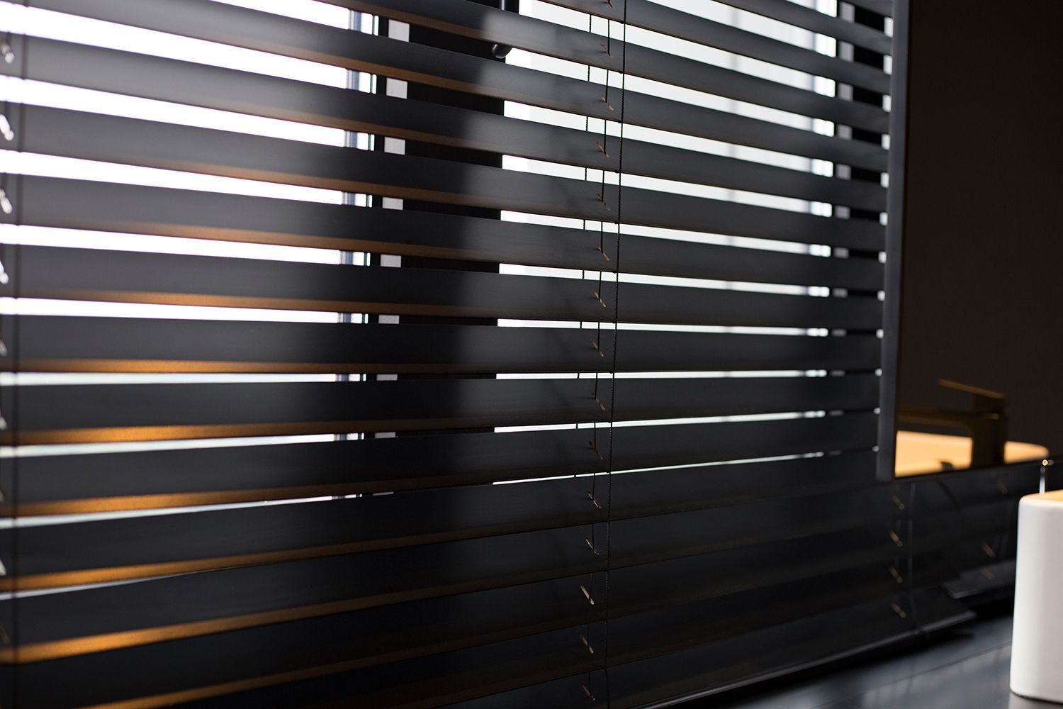 Wood blinds black color closeup on the window.