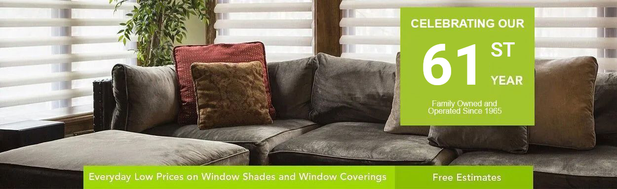 Celebrating Our 61st Year — Sylvan's & Phillip's Drapes & Blinds in Los Angeles, CA A living room with a couch and a sign that says 61st year