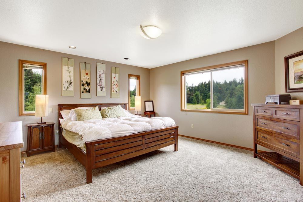 There is a Large Bed in the Middle of the Room — Bayside Carpets & Flooring in Kendall, NSW