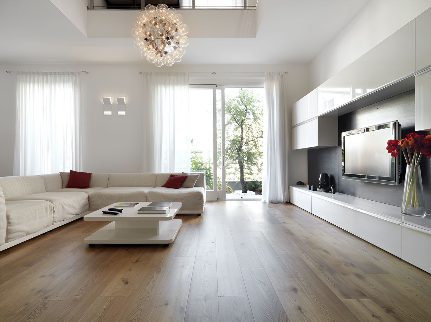 A Living Room With a Couch a Coffee Table and a Television — Bayside Carpets & Flooring in Harrington, NSW